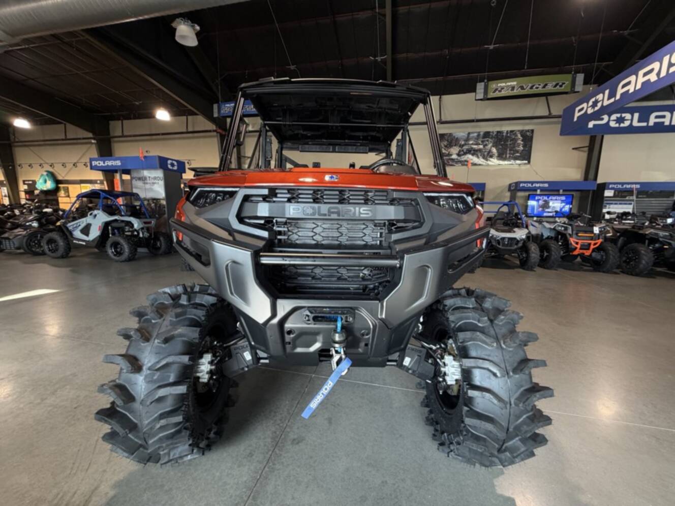 A photo of this 2026 Polaris RGR CREW XP 1000 PREMIUM ORANGE RUST