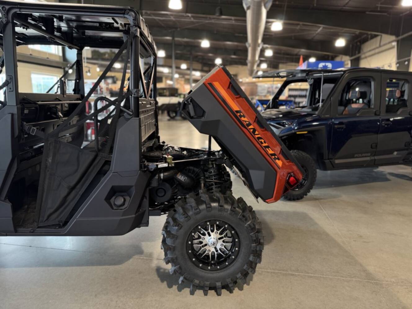 A photo of this 2026 Polaris RGR CREW XP 1000 PREMIUM ORANGE RUST
