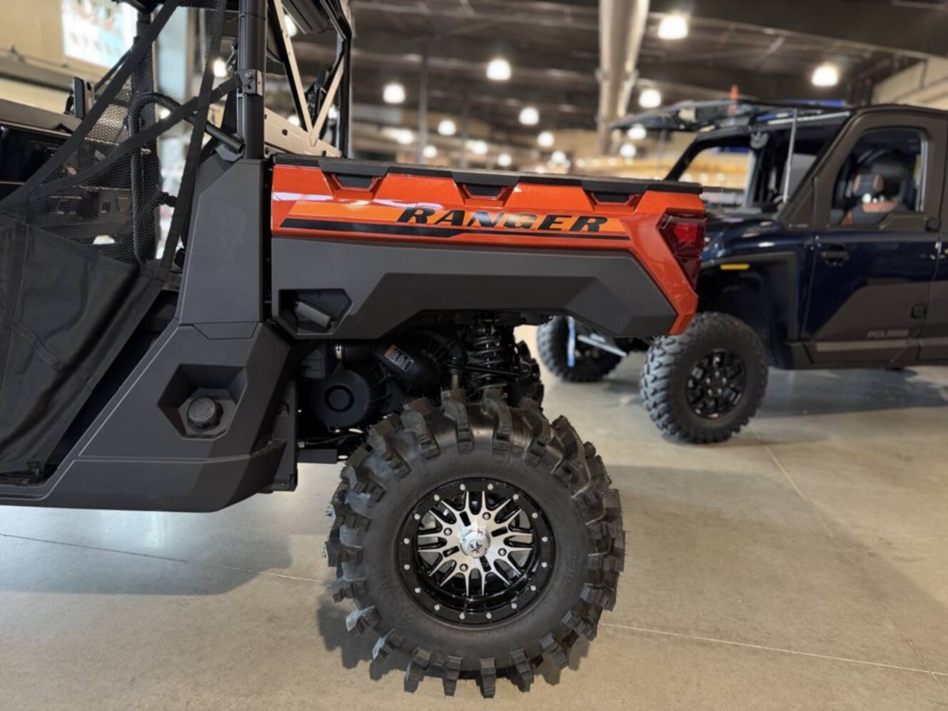 A photo of this 2026 Polaris RGR CREW XP 1000 PREMIUM ORANGE RUST