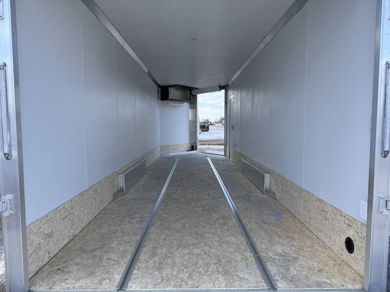 A photo of this 2026 Ez Hauler EZES 7.5X24 Enclosed Snowmobile Trailer