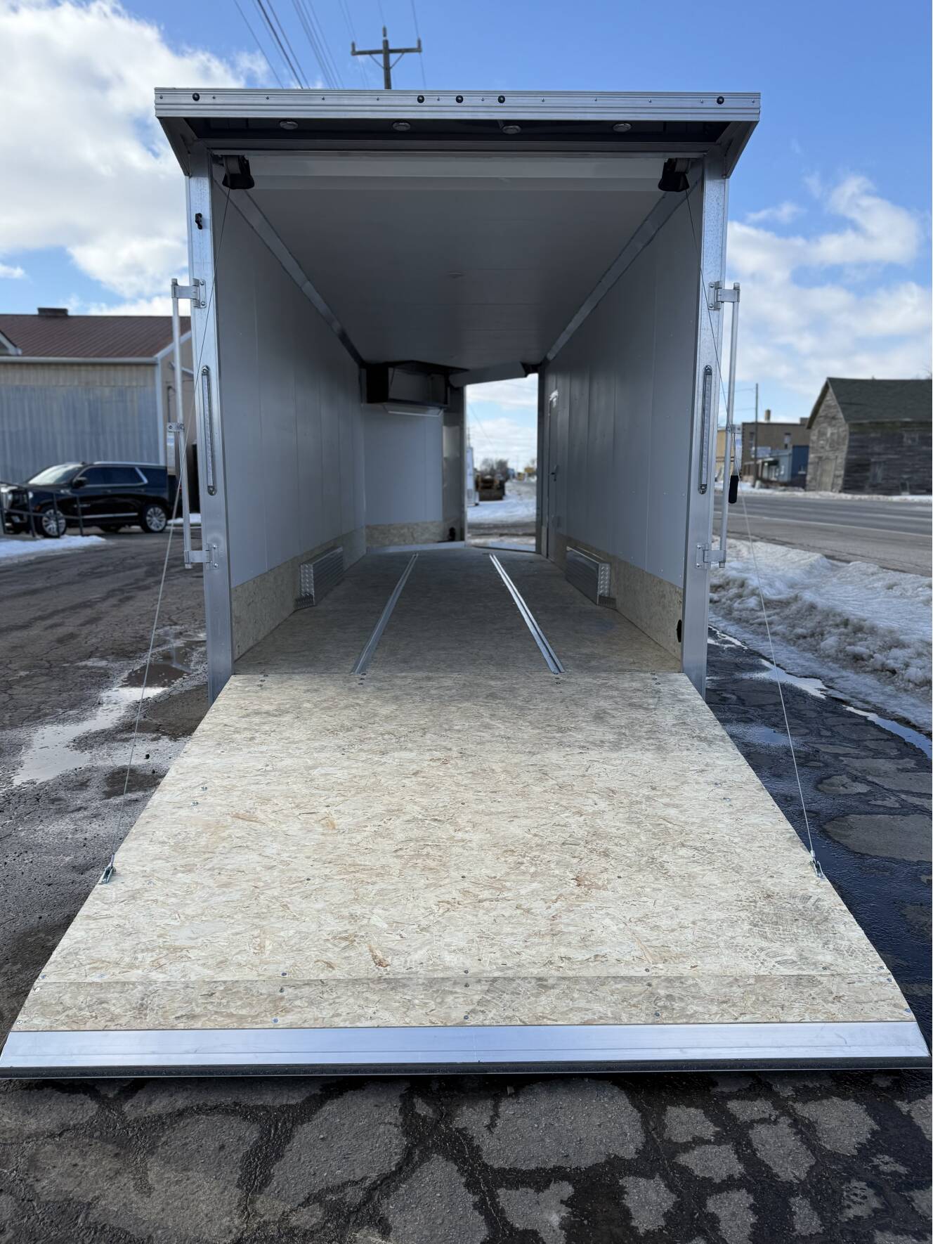 A photo of this 2026 Ez Hauler EZES 7.5X24 Enclosed Snowmobile Trailer