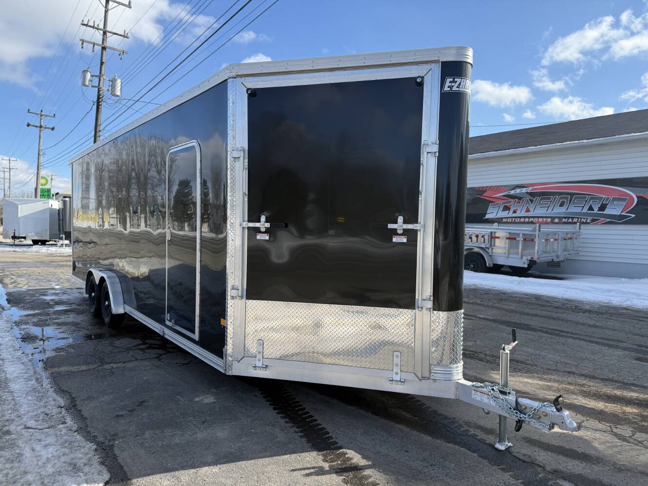 A photo of this 2026 Ez Hauler EZES 7.5X24 Enclosed Snowmobile Trailer