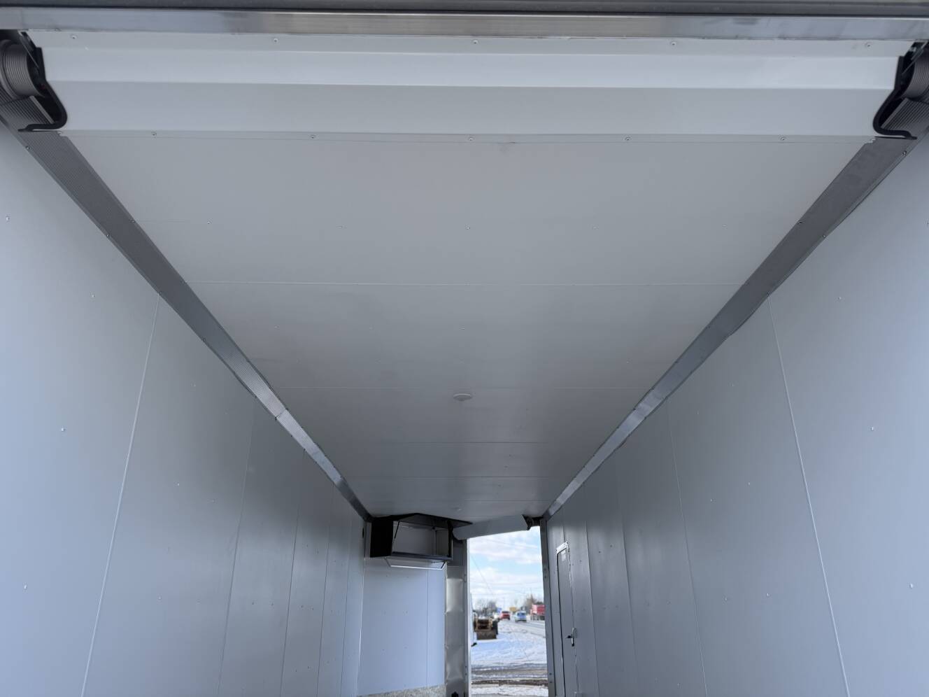 A photo of this 2026 Ez Hauler EZES 7.5X24 Enclosed Snowmobile Trailer