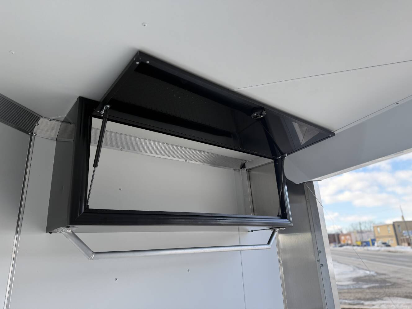 A photo of this 2026 Ez Hauler EZES 7.5X24 Enclosed Snowmobile Trailer