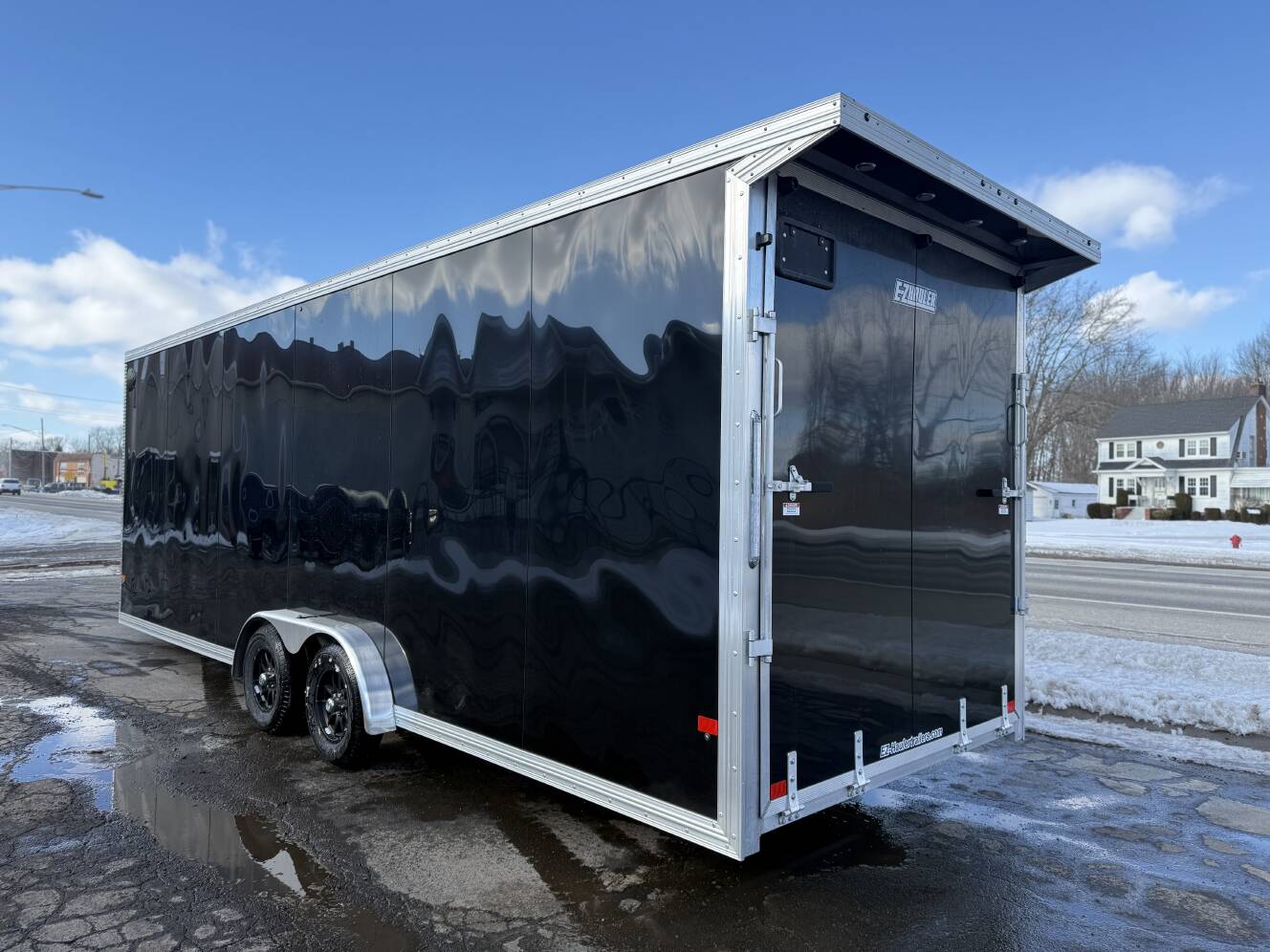 A photo of this 2026 Ez Hauler EZES 7.5X24 Enclosed Snowmobile Trailer