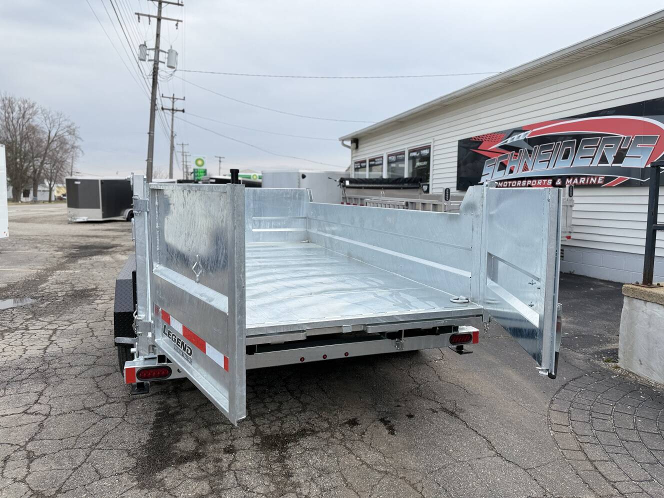 A photo of this 2026 Legend Trailers 7x14 Galvanized Tandem Axle Dump Trailer