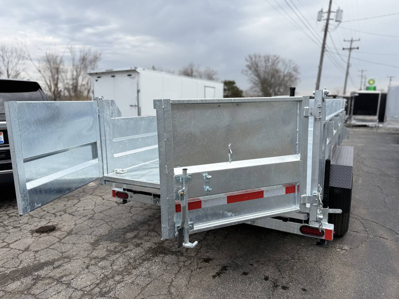 A photo of this 2026 Legend Trailers 7x14 Galvanized Tandem Axle Dump Trailer