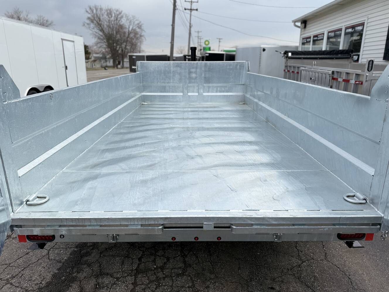 A photo of this 2026 Legend Trailers 7x14 Galvanized Tandem Axle Dump Trailer