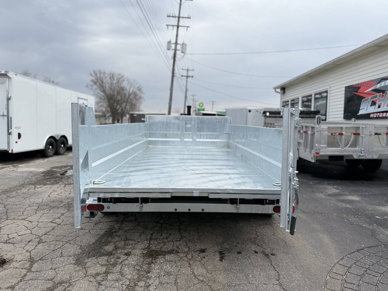 A photo of this 2026 Legend Trailers 7x14 Galvanized Tandem Axle Dump Trailer