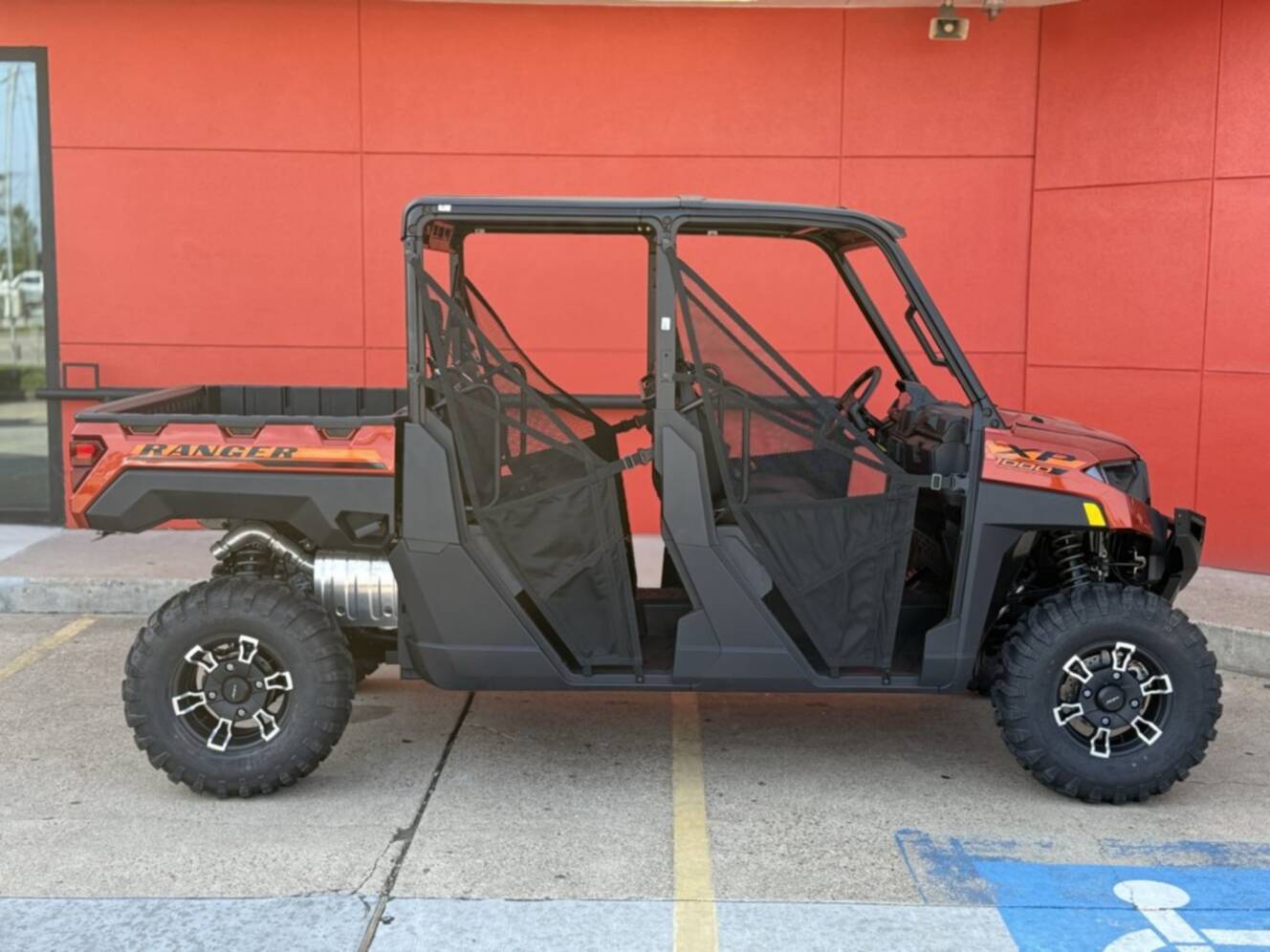 A photo of this 2026 Polaris RGR CREW XP 1000 PREMIUM ORANGE RUST Premium