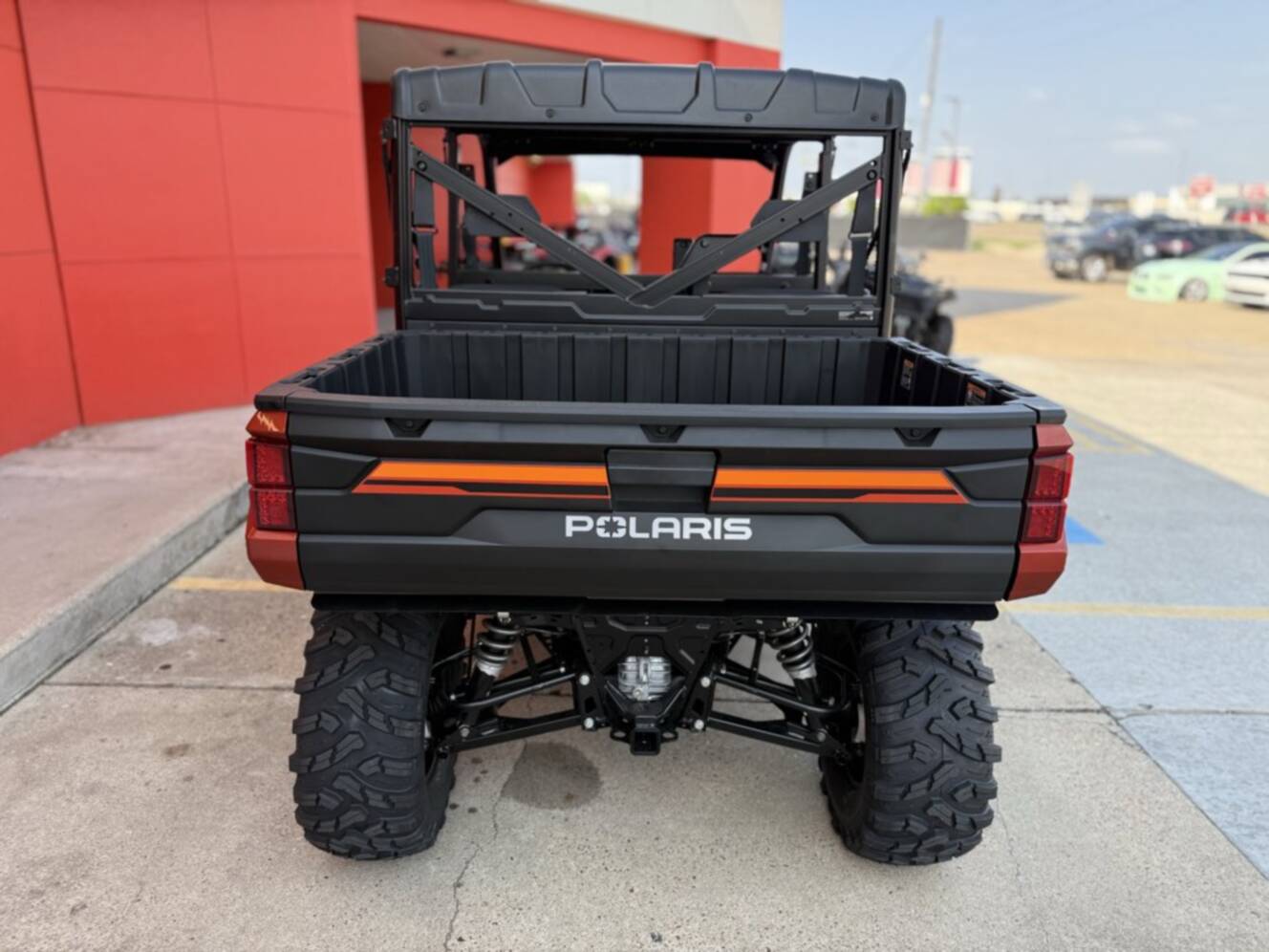 A photo of this 2026 Polaris RGR CREW XP 1000 PREMIUM ORANGE RUST Premium