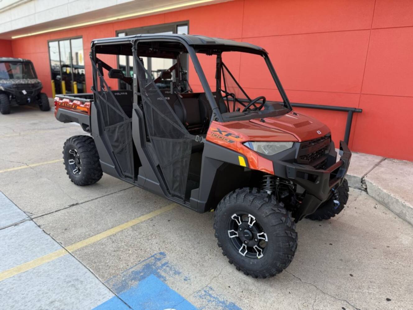 A photo of this 2026 Polaris RGR CREW XP 1000 PREMIUM ORANGE RUST Premium