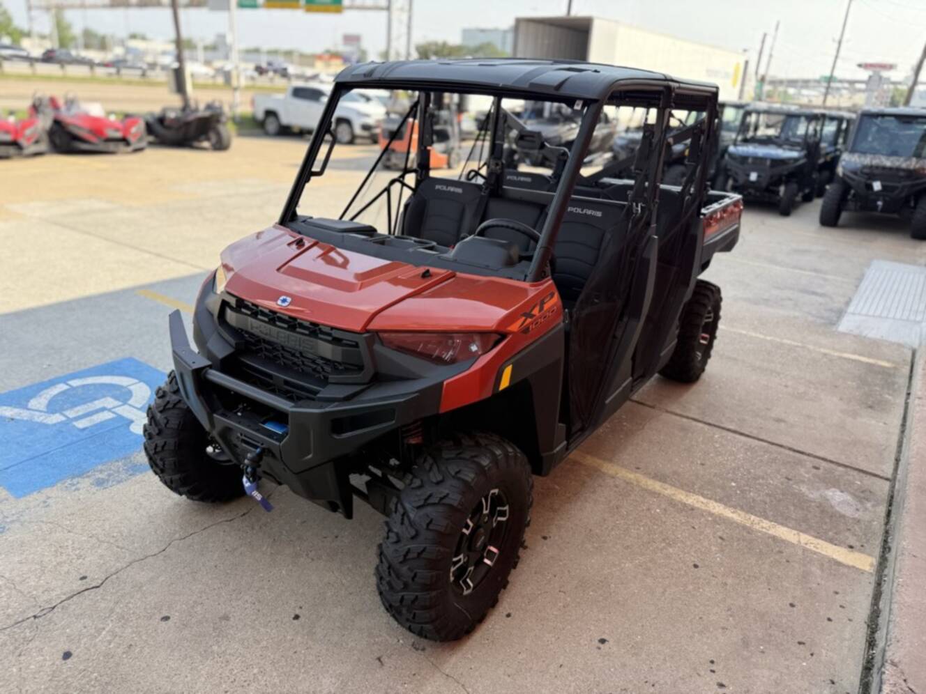A photo of this 2026 Polaris RGR CREW XP 1000 PREMIUM ORANGE RUST Premium