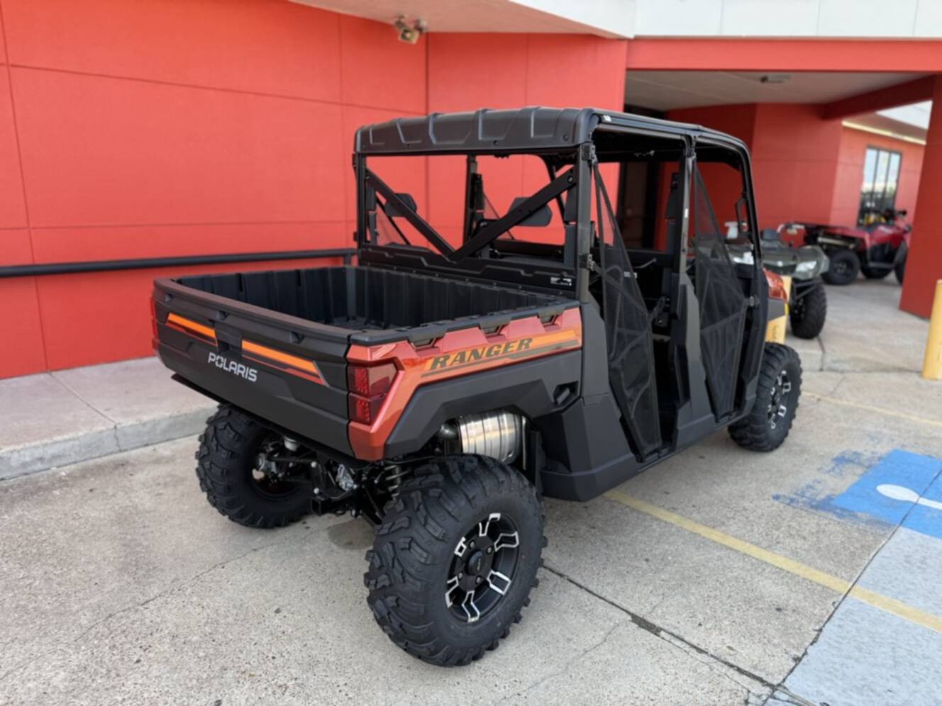 A photo of this 2026 Polaris RGR CREW XP 1000 PREMIUM ORANGE RUST Premium