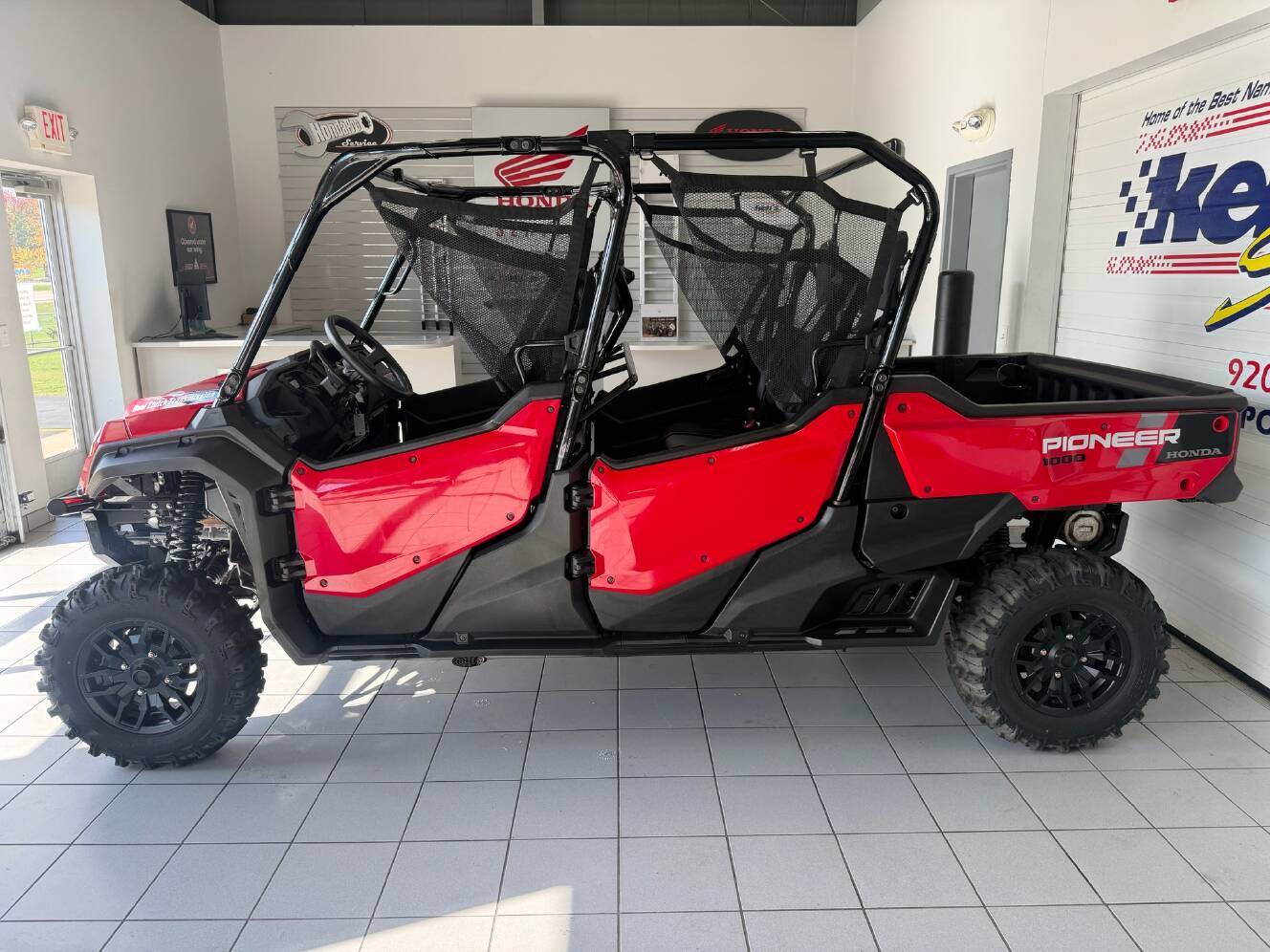 A photo of this 2024 Honda Pioneer 1000-6 Deluxe Crew