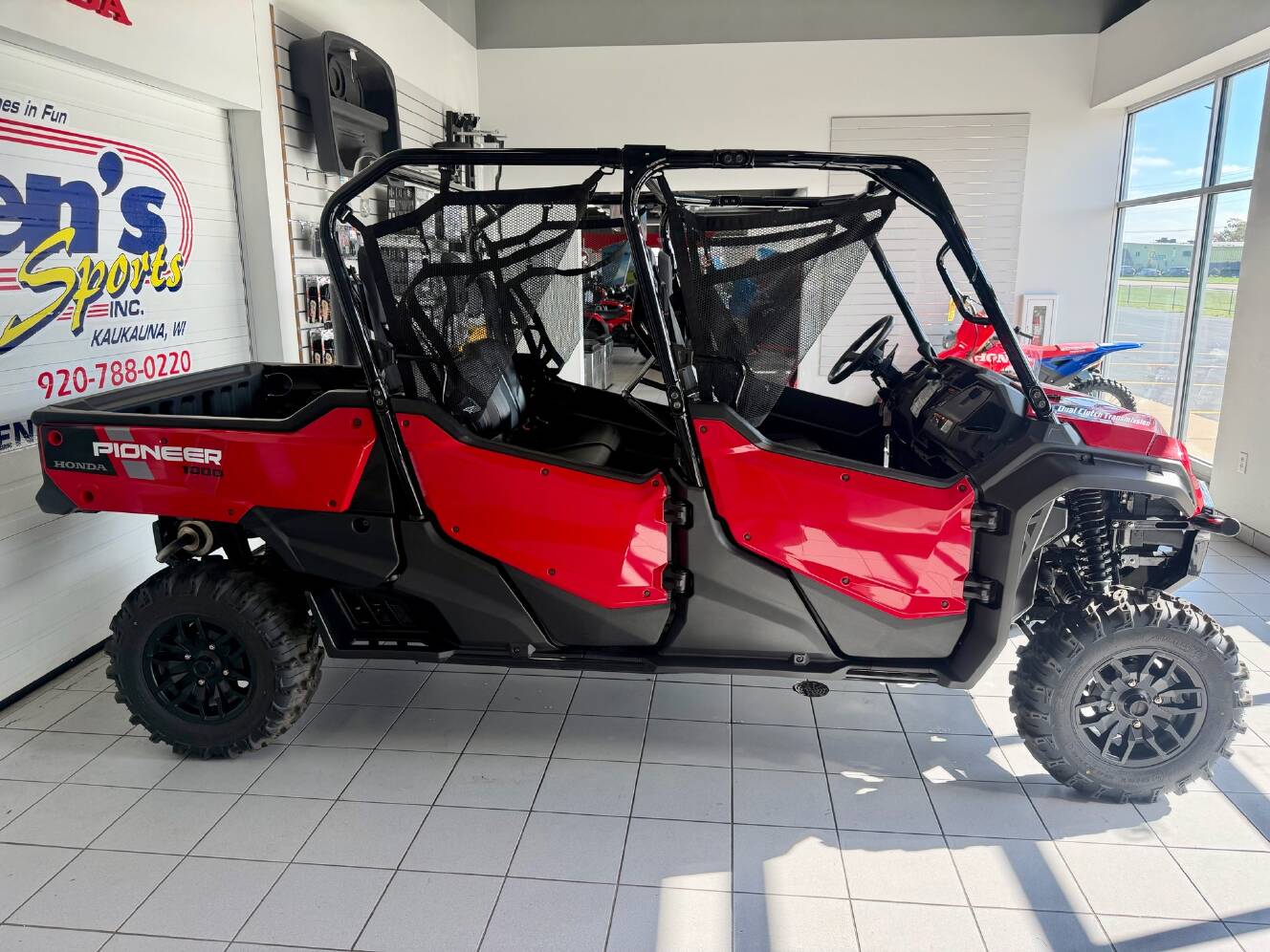 A photo of this 2024 Honda Pioneer 1000-6 Deluxe Crew