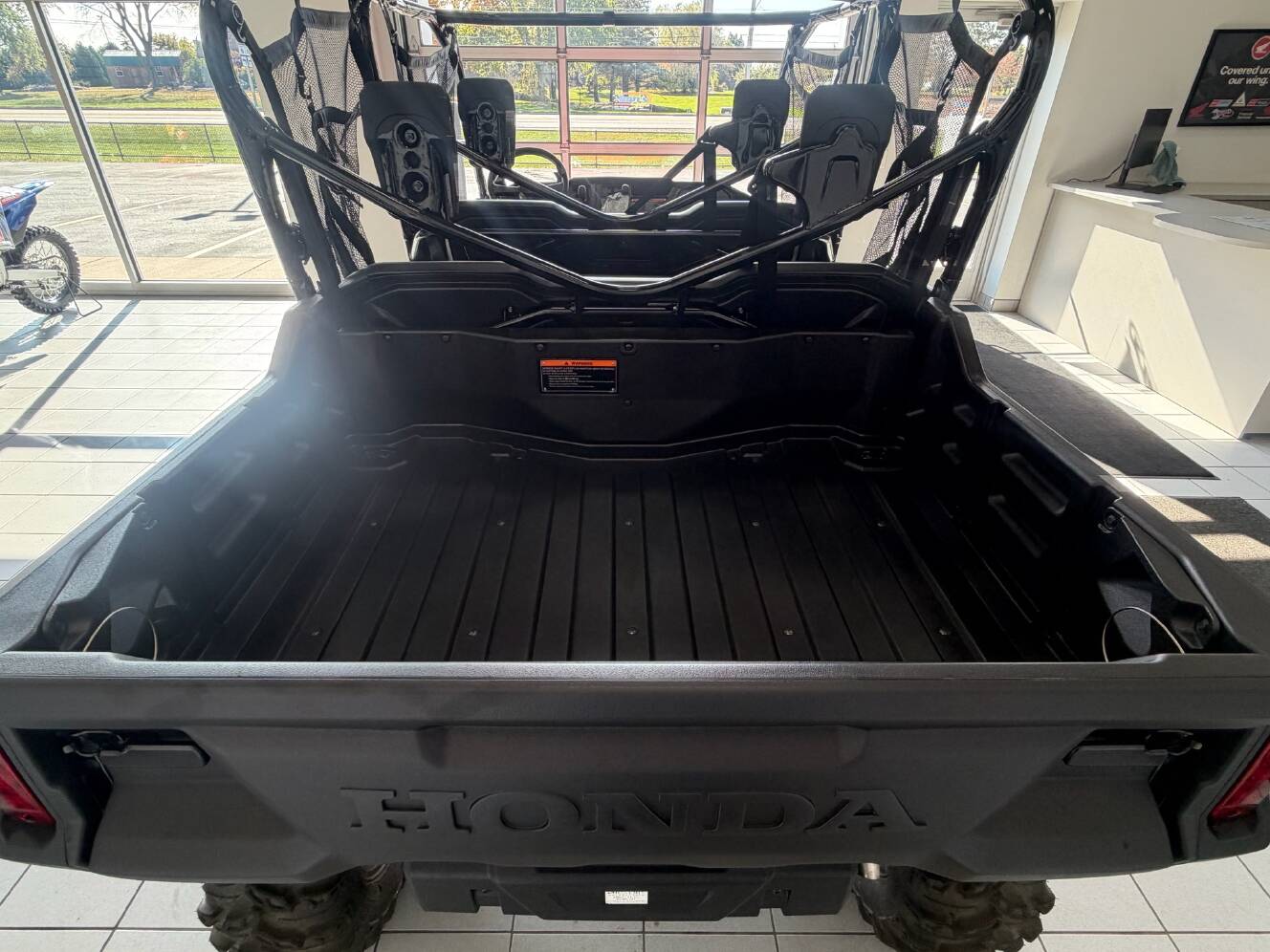 A photo of this 2024 Honda Pioneer 1000-6 Deluxe Crew