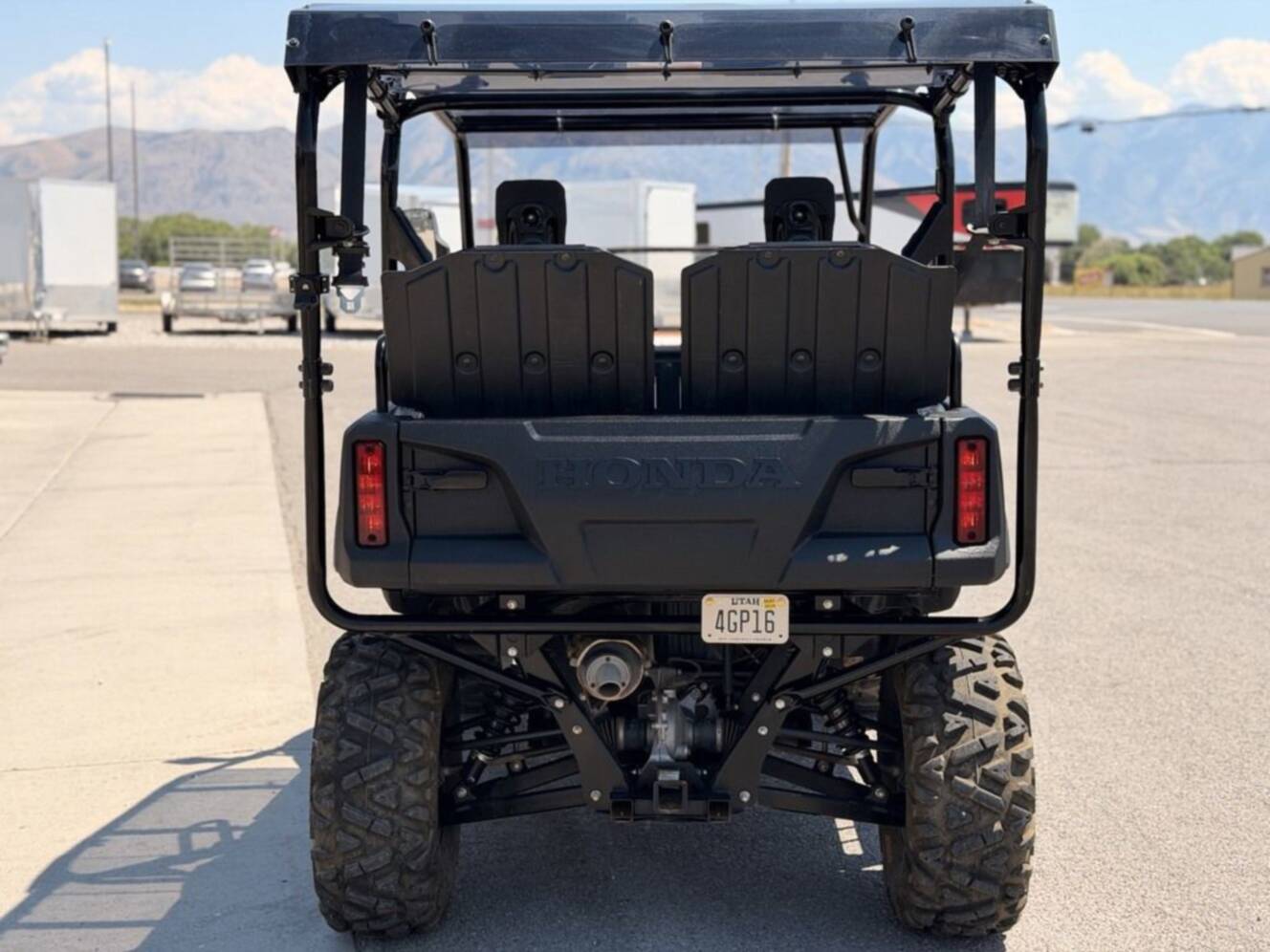 A photo of this 2021 Honda Pioneer 700-4 Deluxe Honda Phantom Camo
