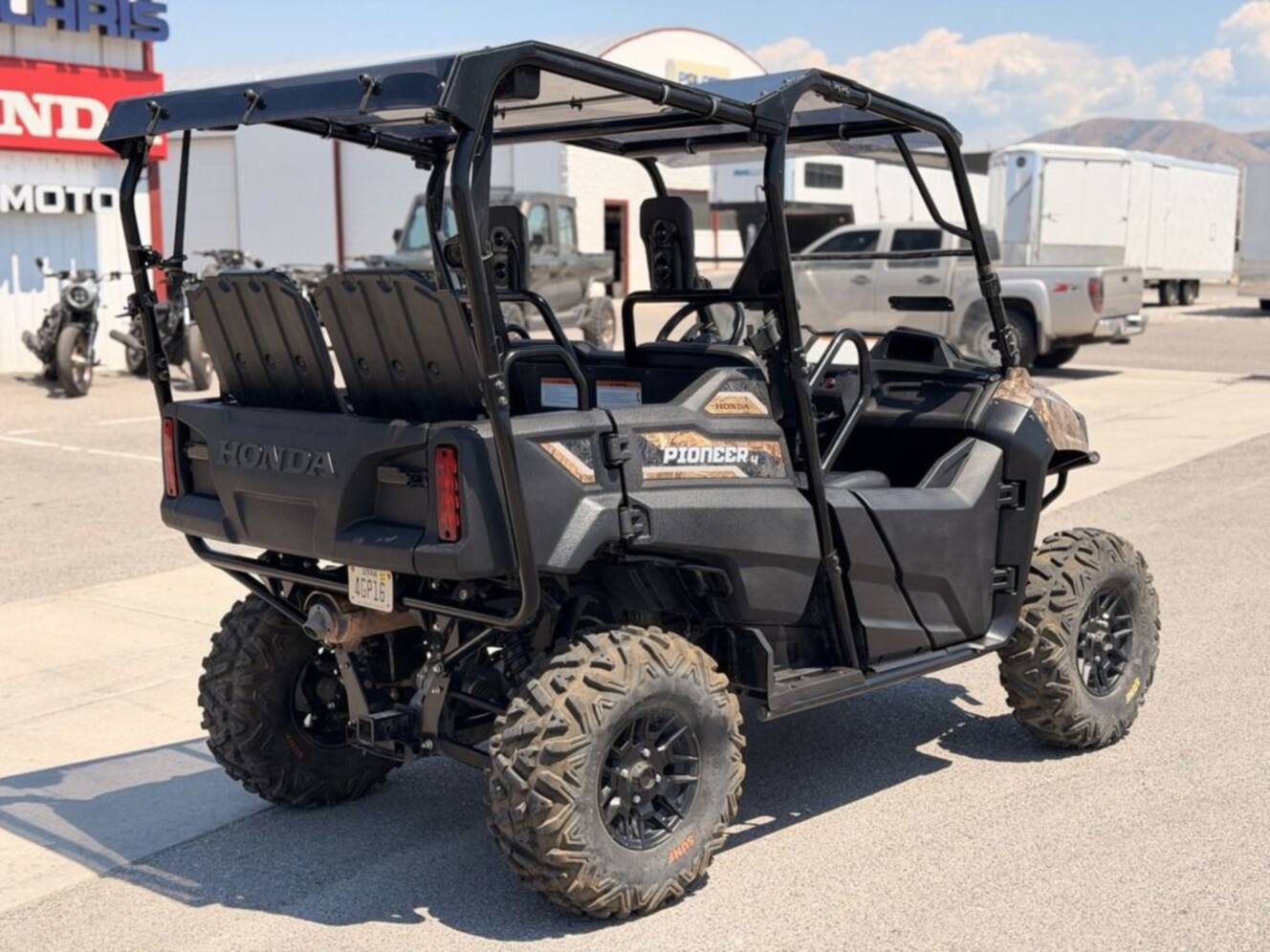 A photo of this 2021 Honda Pioneer 700-4 Deluxe Honda Phantom Camo