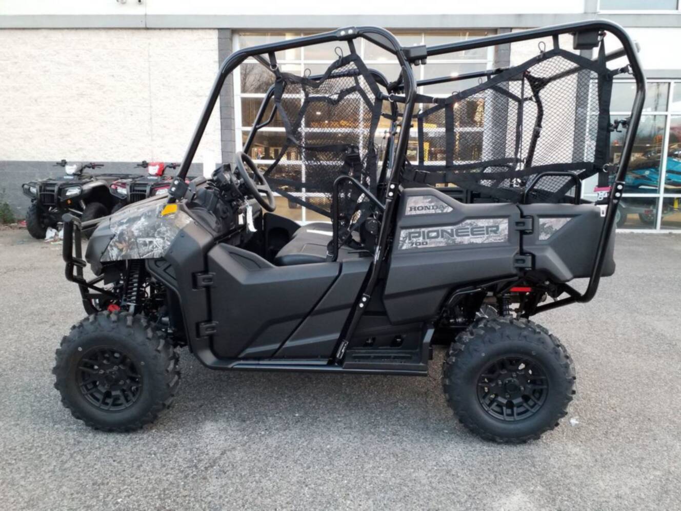 A photo of this 2026 Honda Pioneer 700-4 Forest