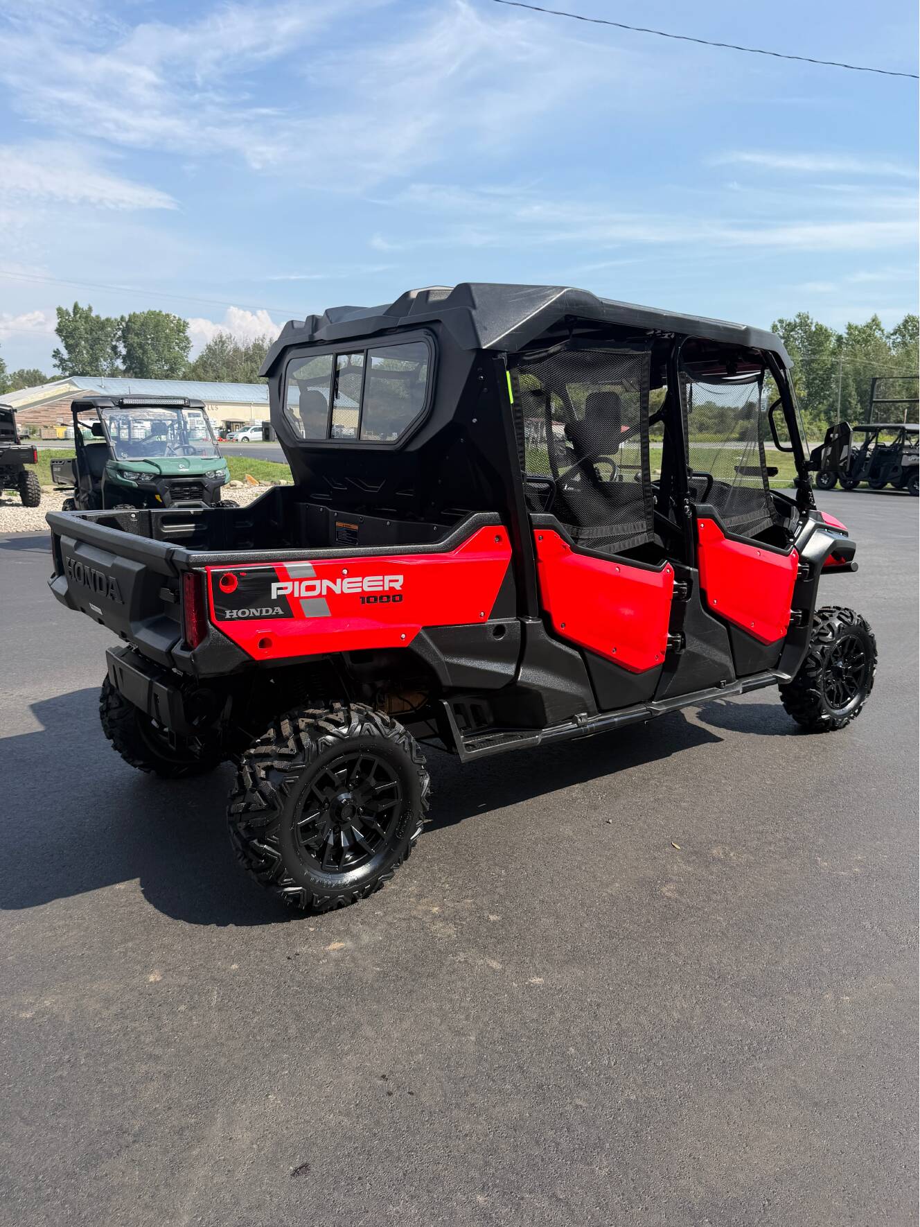 A photo of this 2023 Honda PIONEER 1000-6 CREW DELUXE