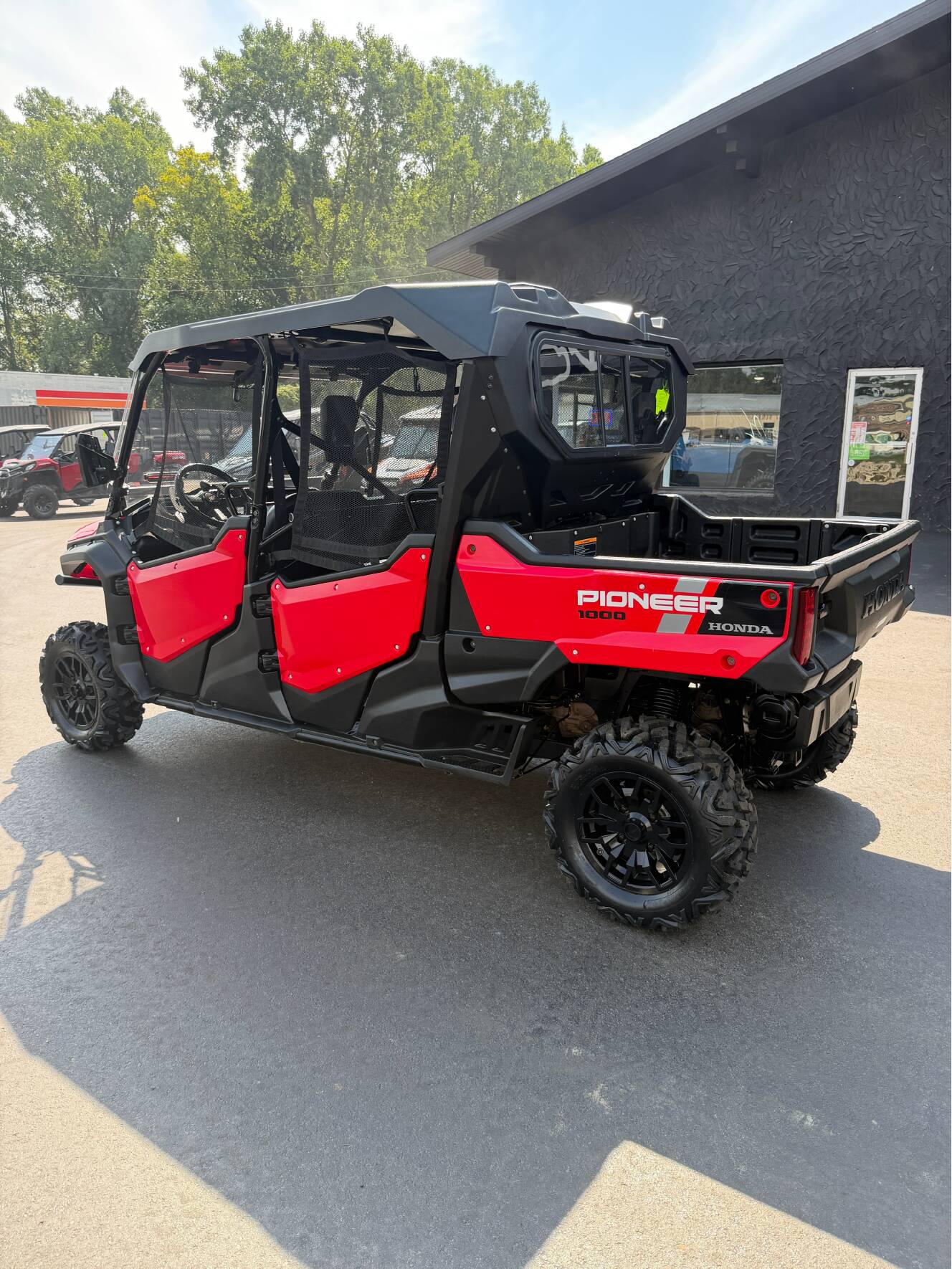A photo of this 2023 Honda PIONEER 1000-6 CREW DELUXE