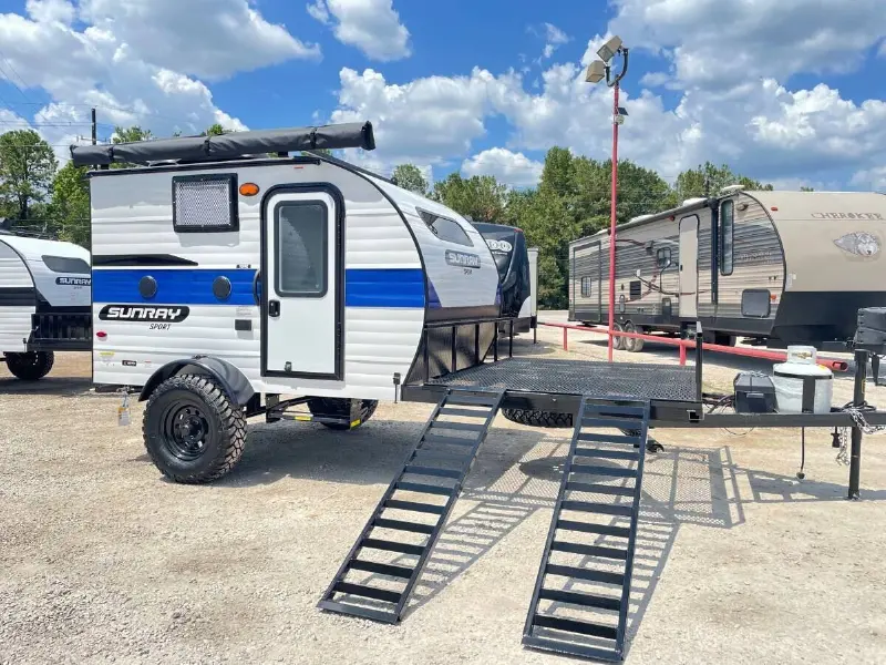 2022 Sunset Park RV Sunray 109E Hauler Sport With Bike Rack Lifted Outside