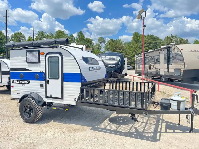 2022 Sunset Park RV Sunray 109E Hauler Sport With Bike Rack Lifted Outside