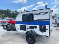 2022 Sunset Park RV Sunray 109E Hauler Sport With Bike Rack Lifted Outside