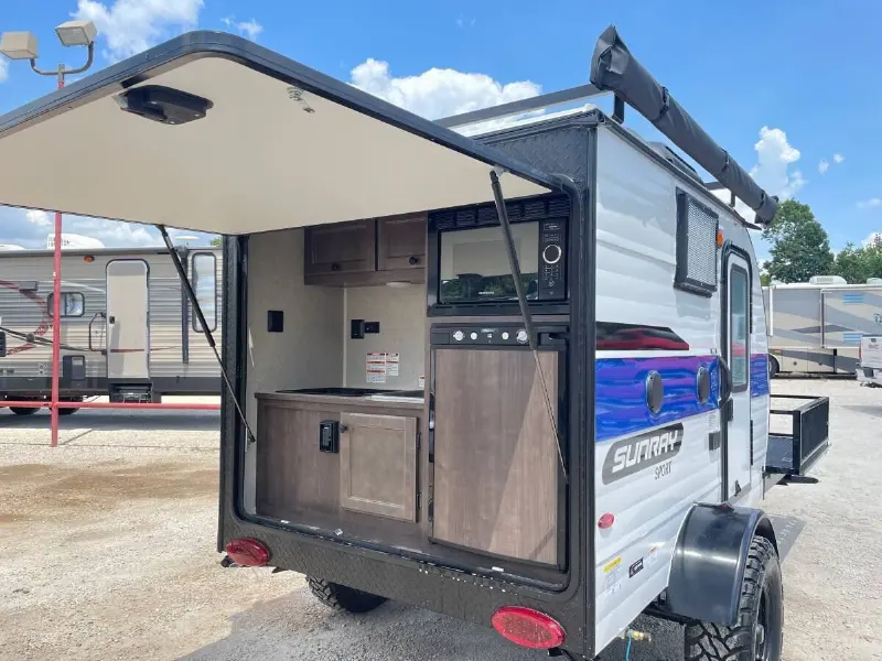 2022 Sunset Park RV Sunray 109E Hauler Sport With Bike Rack Lifted Outside
