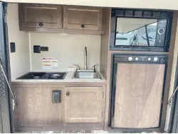 2022 Sunset Park RV Sunray 109E Hauler Sport With Bike Rack Lifted Outside