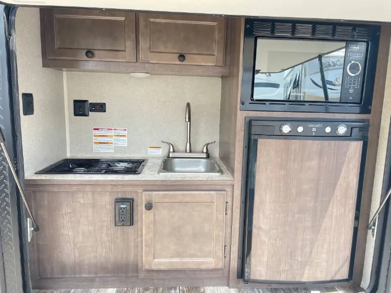 2022 Sunset Park RV Sunray 109E Hauler Sport With Bike Rack Lifted Outside