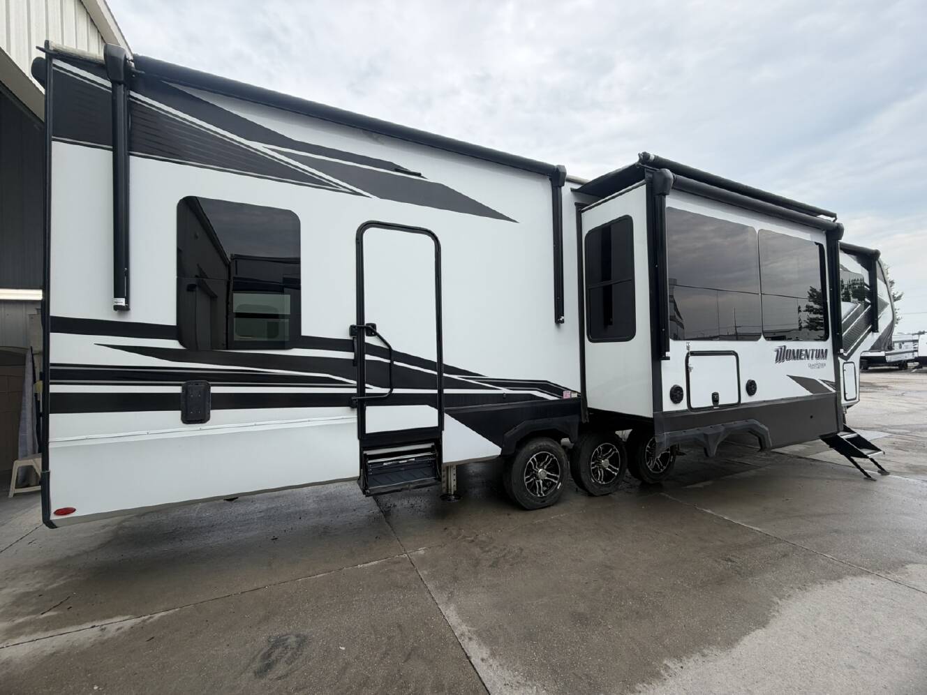 A photo of this 2023 Grand Design Momentum M-Class 397THS