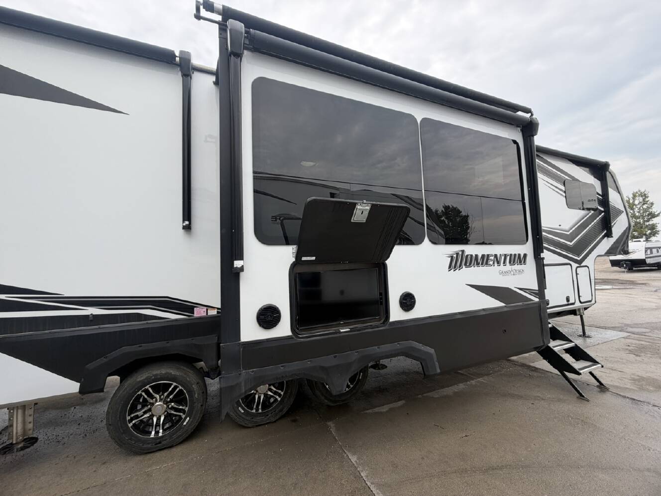 A photo of this 2023 Grand Design Momentum M-Class 397THS