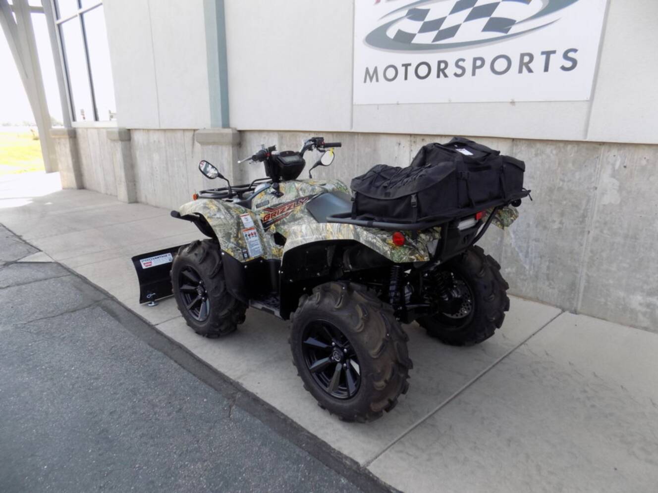 A photo of this 2024 Yamaha Grizzly EPS Camo
