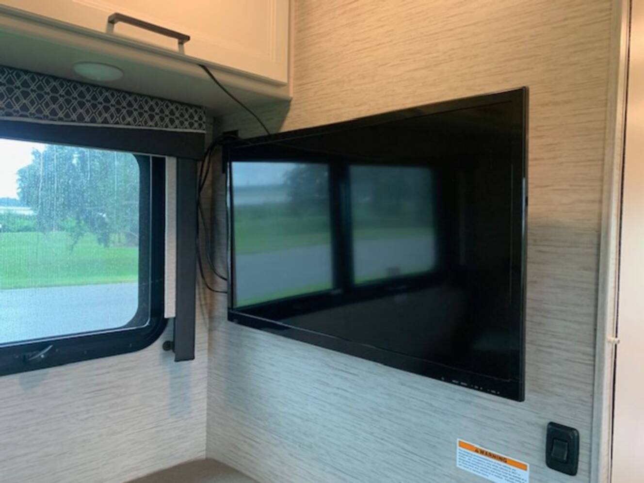 A photo of this 2021 Thor Motor Coach Axis 24.1