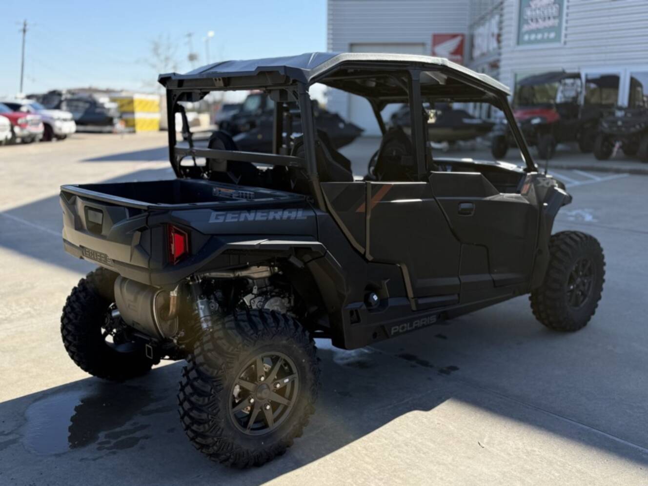 A photo of this 2026 Polaris GENERAL XP 4 1000 ULTIMATE SUPER GRAPHITE Ultimate