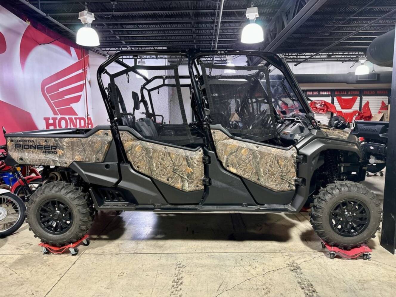 A photo of this 2025 Honda® Pioneer 1000-6 Deluxe Crew TrueTimber Atera Camo