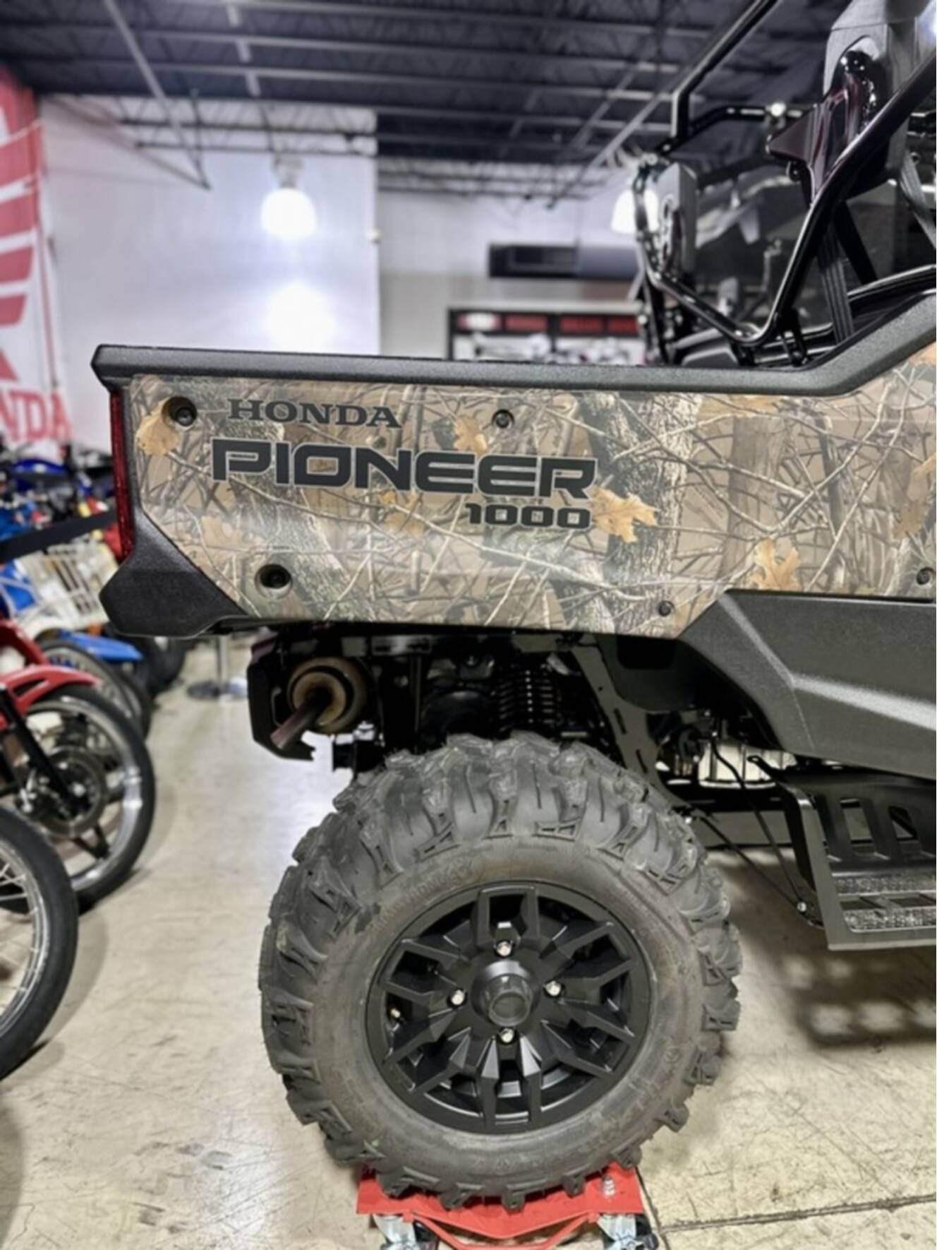 A photo of this 2025 Honda® Pioneer 1000-6 Deluxe Crew TrueTimber Atera Camo
