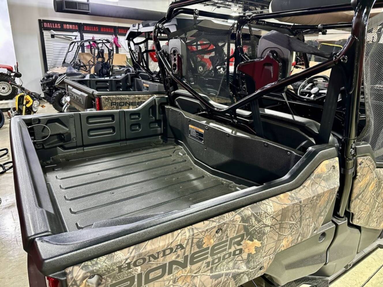 A photo of this 2025 Honda® Pioneer 1000-6 Deluxe Crew TrueTimber Atera Camo