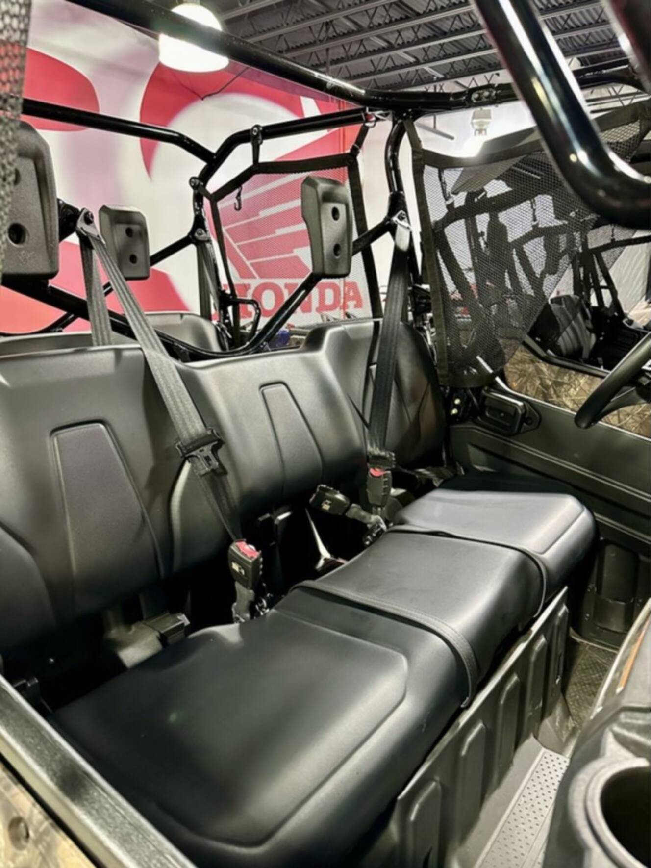 A photo of this 2025 Honda® Pioneer 1000-6 Deluxe Crew TrueTimber Atera Camo