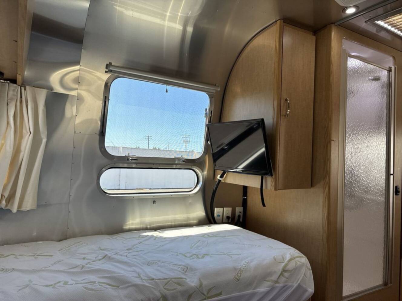 A photo of this 2016 Airstream Flying Cloud 28 Rear Bed Twin