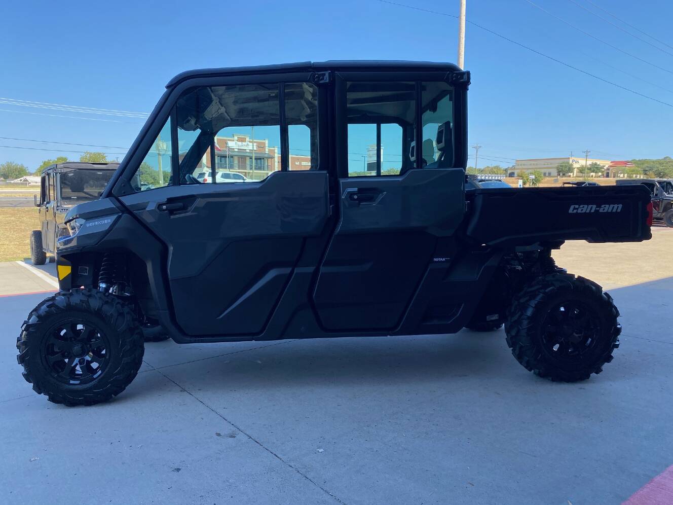A photo of this 2027 Can-Am Defender MAX DPS CAB HD10 Dolomite Grey