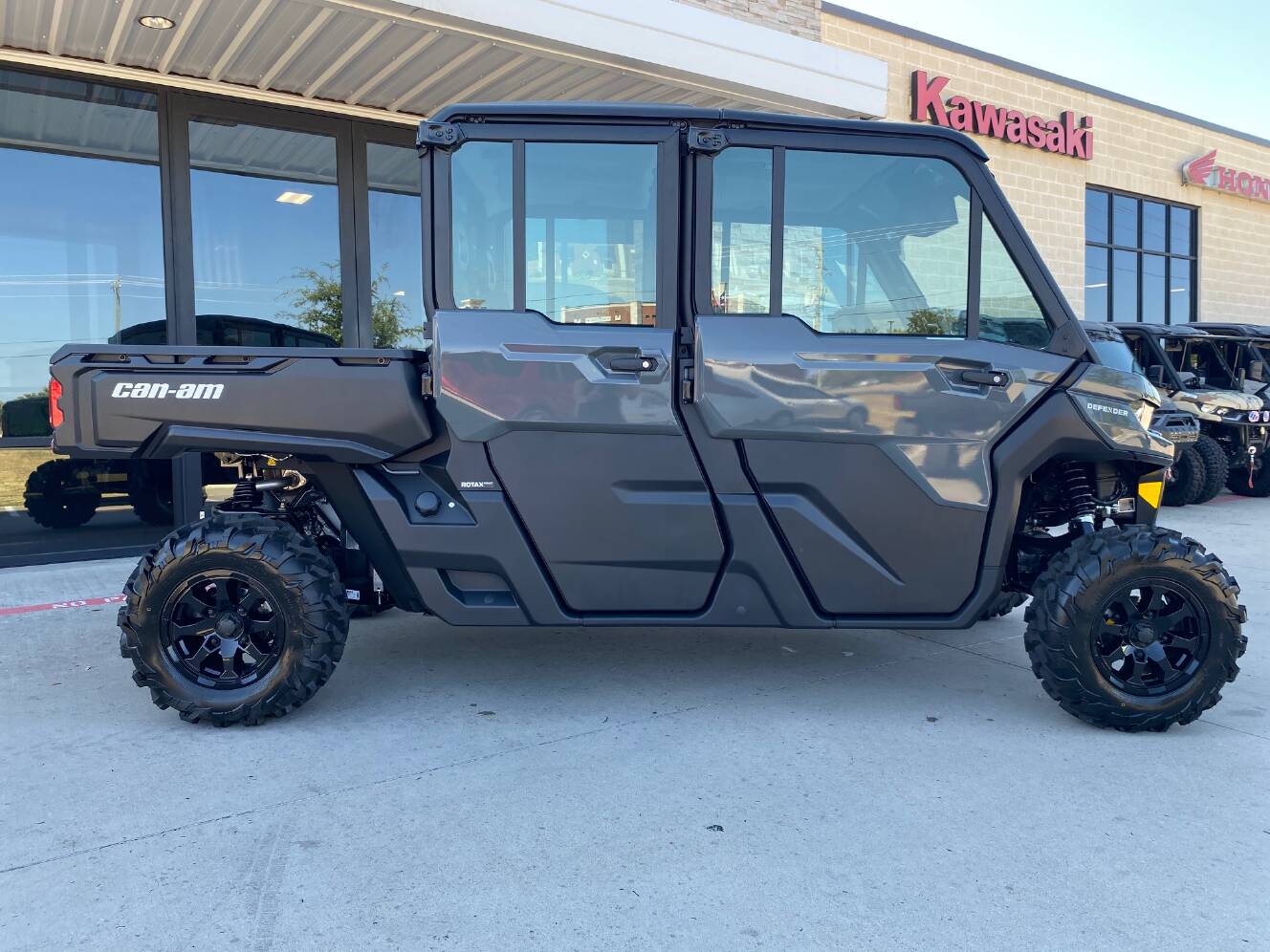 A photo of this 2027 Can-Am Defender MAX DPS CAB HD10 Dolomite Grey
