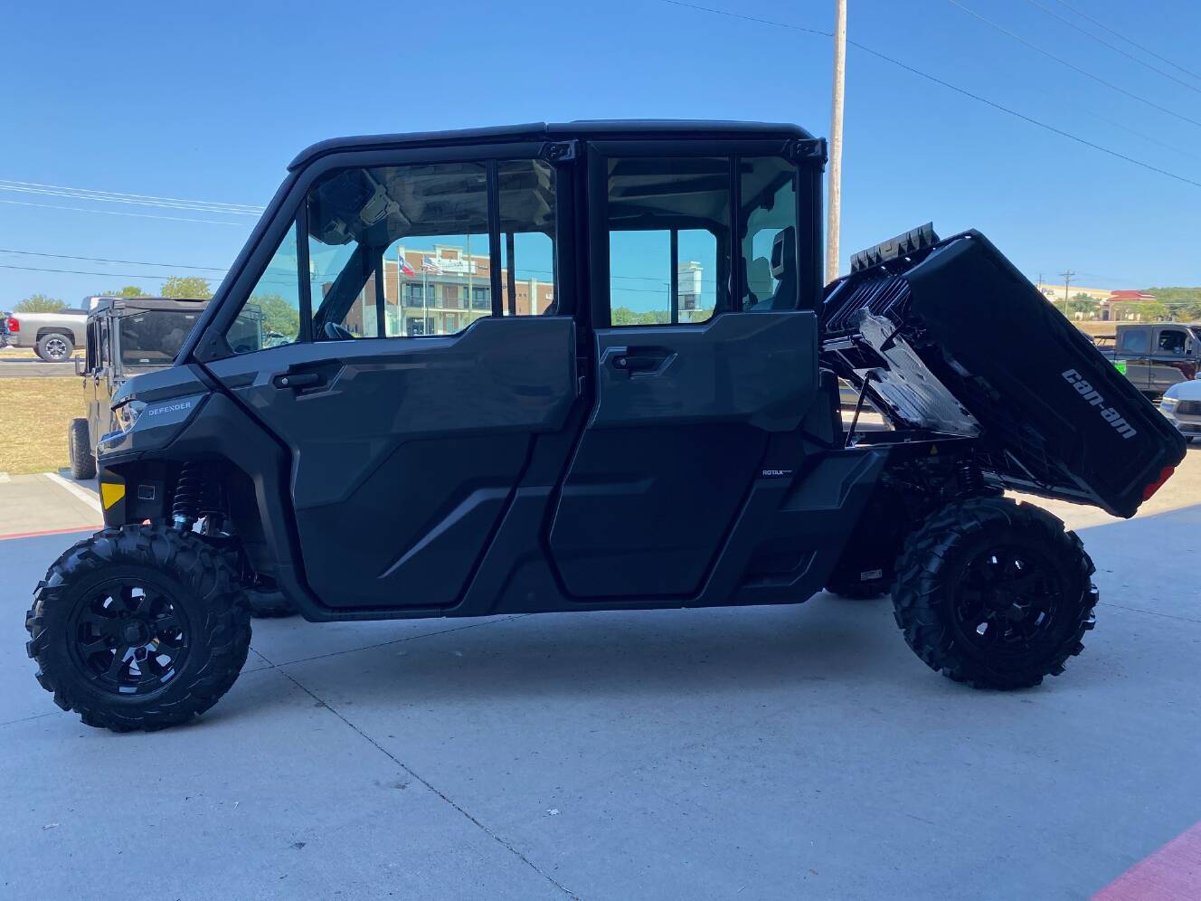 A photo of this 2027 Can-Am Defender MAX DPS CAB HD10 Dolomite Grey