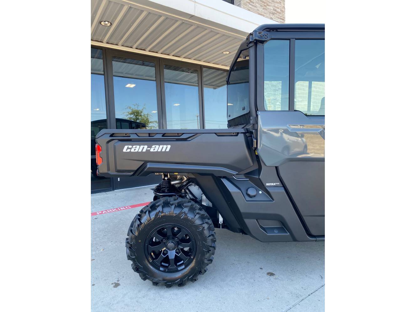 A photo of this 2027 Can-Am Defender MAX DPS CAB HD10 Dolomite Grey