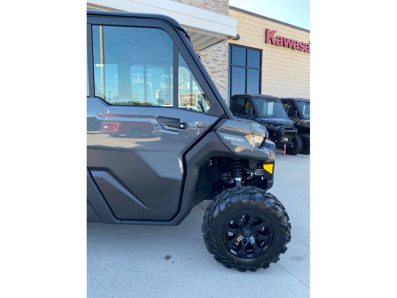 A photo of this 2027 Can-Am Defender MAX DPS CAB HD10 Dolomite Grey