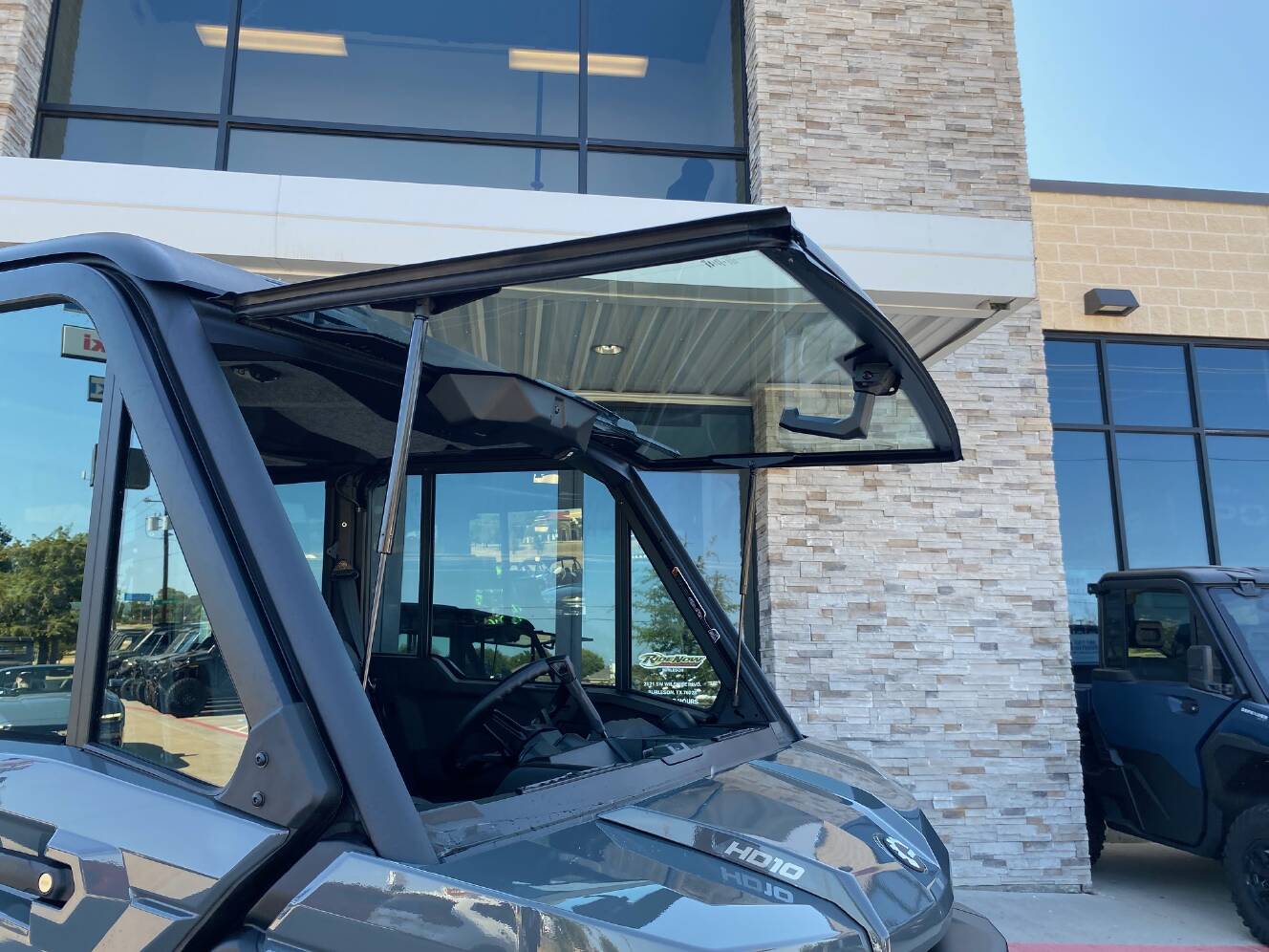 A photo of this 2027 Can-Am Defender MAX DPS CAB HD10 Dolomite Grey
