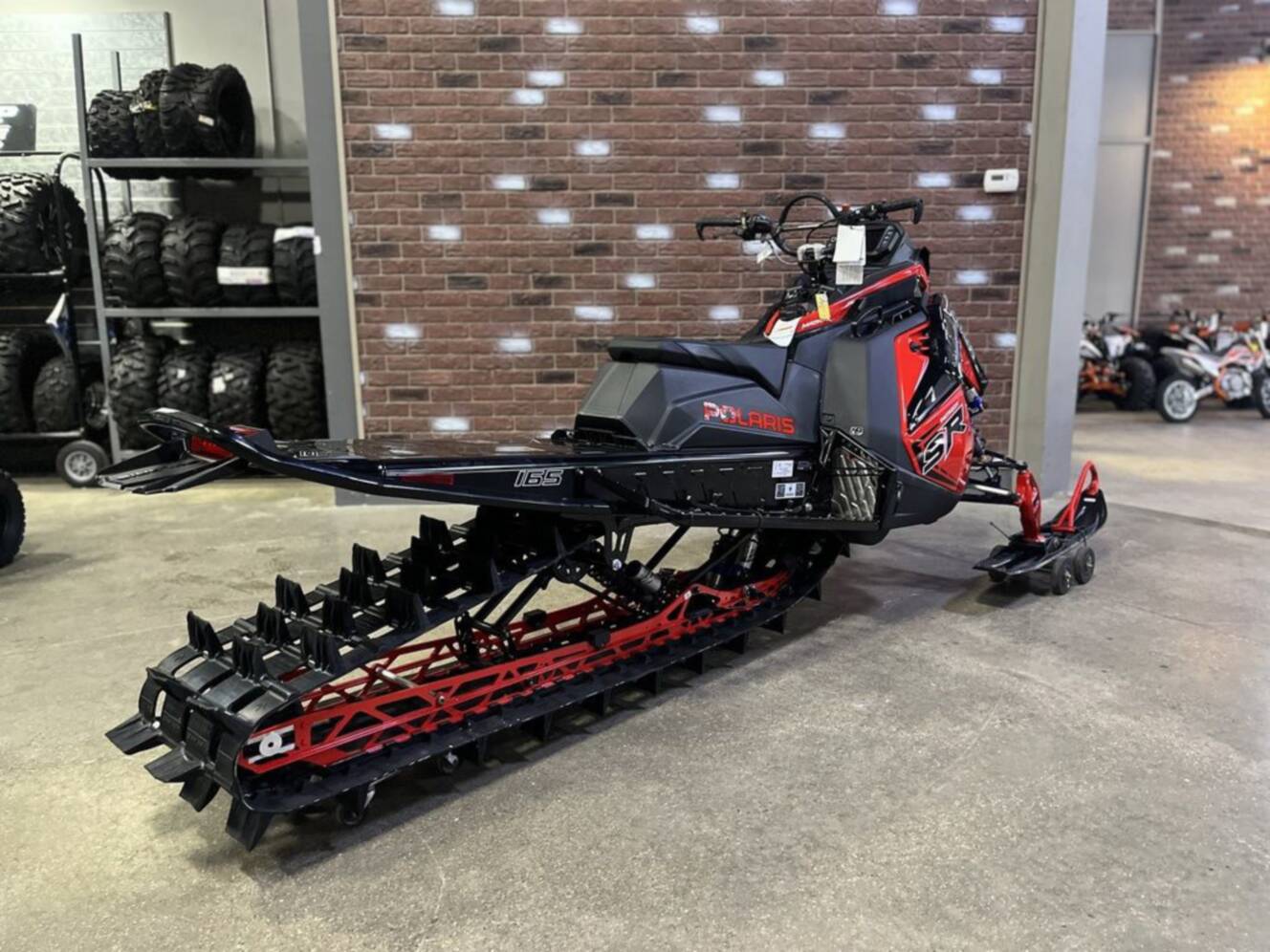A photo of this 2026 Polaris Patriot 9R RMK Khaos 165 Indy Red / Gloss Black Patriot