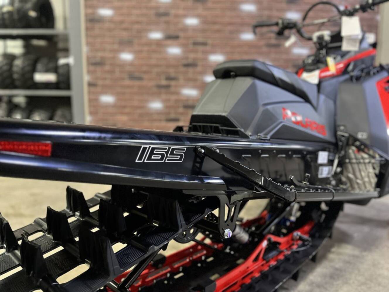 A photo of this 2026 Polaris Patriot 9R RMK Khaos 165 Indy Red / Gloss Black Patriot